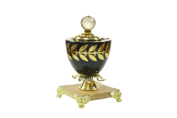 Black incense burner with wooden base - decorated with leaves